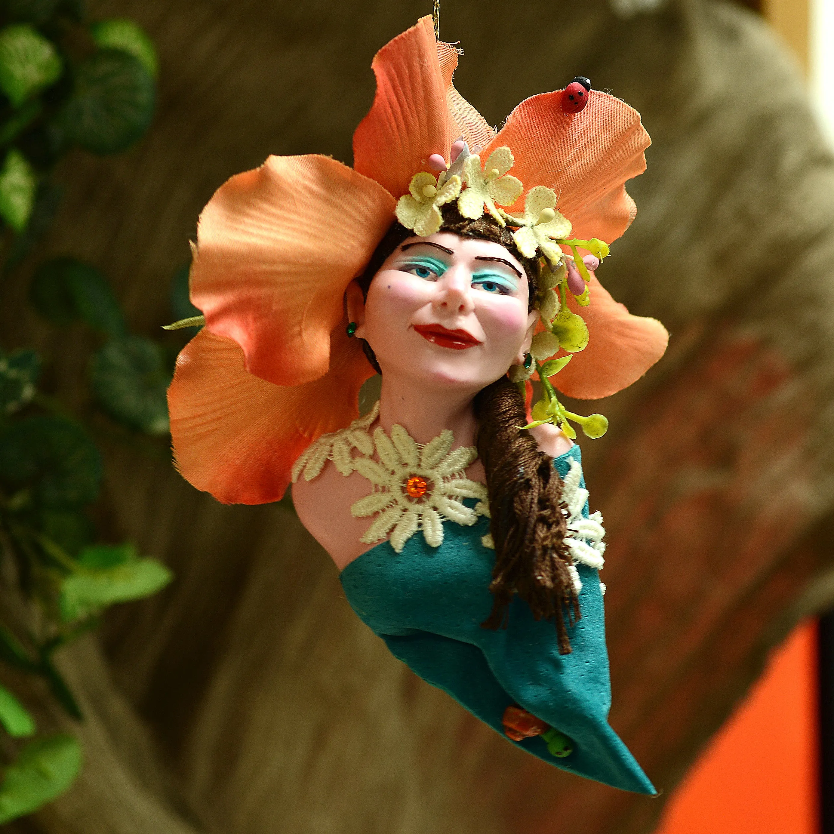 Orchid flower Ornament - Lovely female face with flowers in her hair surrounded by mini daisies